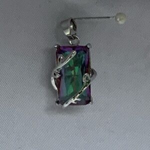 Topaz pendant with silver vines.